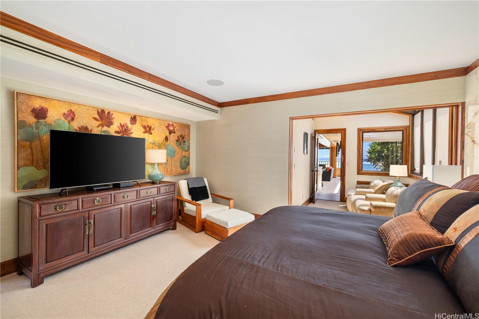 3165 Diamond Head Road, Unit 4 Honolulu, HI 96815 - Photo 16 of 25 a bedroom with furniture and a flat screen tv