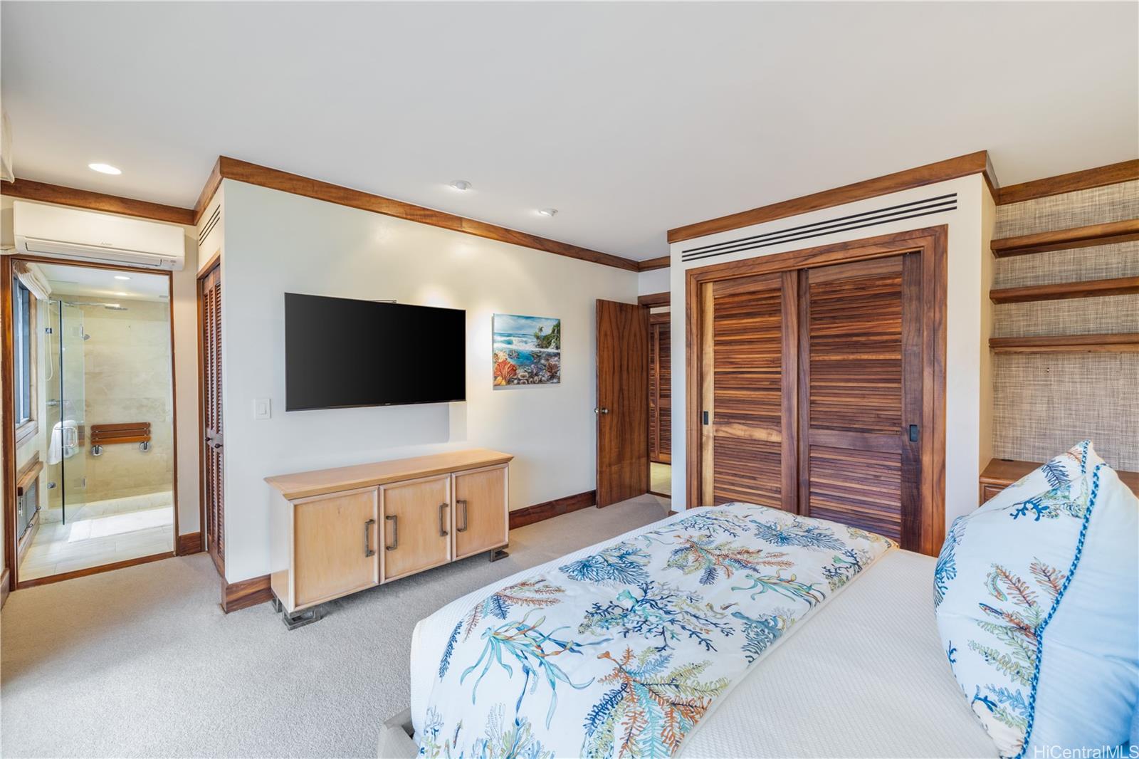3165 Diamond Head Road, Unit 4 Honolulu, HI 96815 - Photo 19 of 25 a bedroom with a bed and a flat screen tv