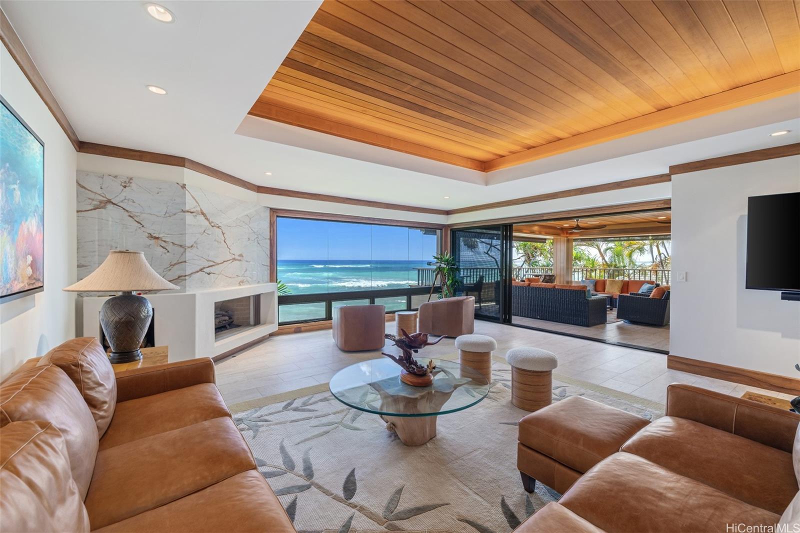 3165 Diamond Head Road, Unit 4 Honolulu, HI 96815 - Photo 6 of 25 a living room with fireplace furniture and a large window