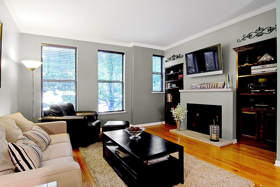 1722 North Bissell Street Chicago, IL 60614 - Photo 3 of 8 a living room with furniture flat screen tv and a fireplace