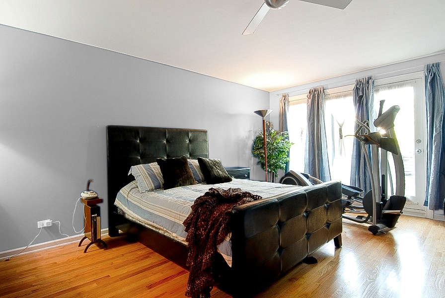 1722 North Bissell Street Chicago, IL 60614 - Photo 5 of 8 a bedroom with a bed and wooden floor