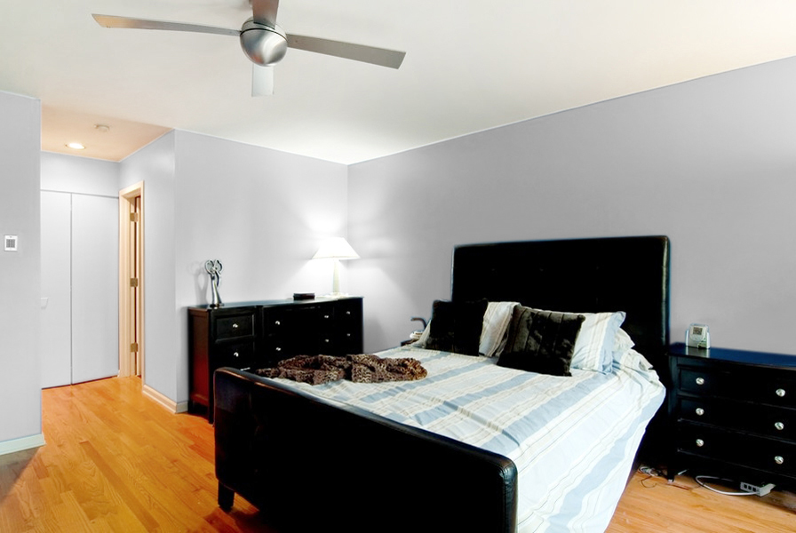 1722 North Bissell Street Chicago, IL 60614 - Photo 6 of 8 a bedroom with a bed and a lamp