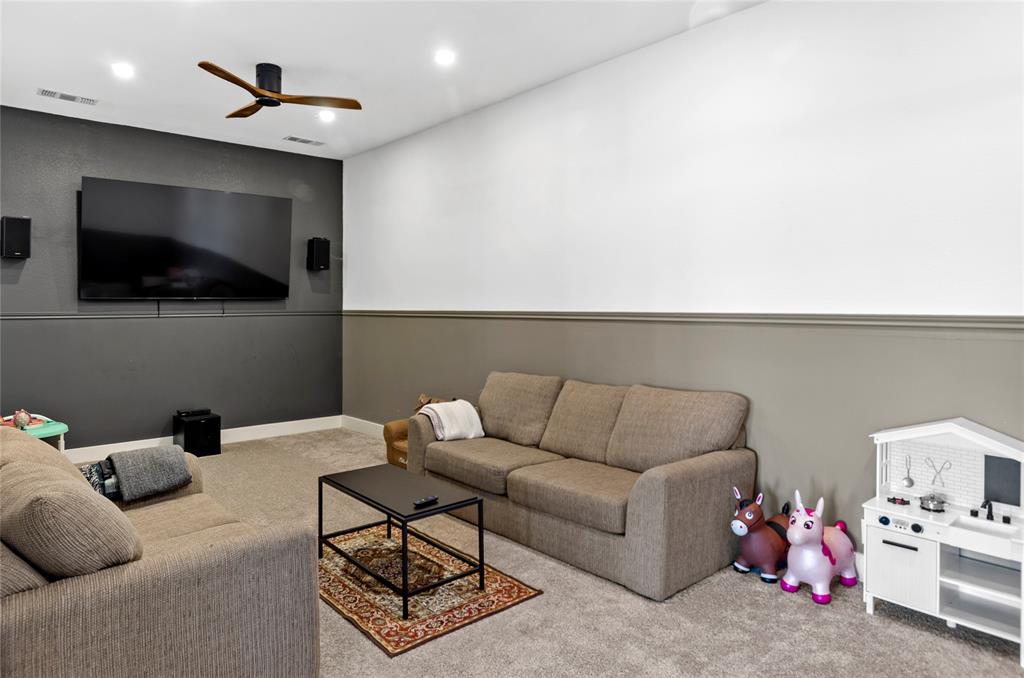 396 Ranchview Court Bowie, TX 76230 - Photo 20 of 40 a living room with furniture and a flat screen tv