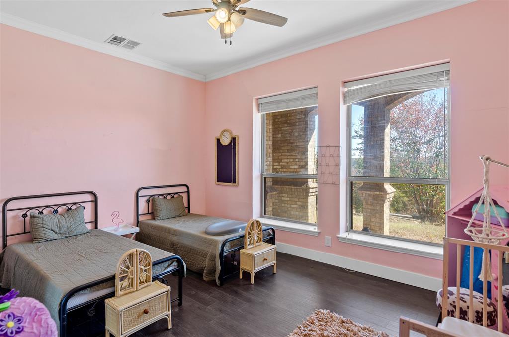 396 Ranchview Court Bowie, TX 76230 - Photo 23 of 40 a bedroom with furniture and a window