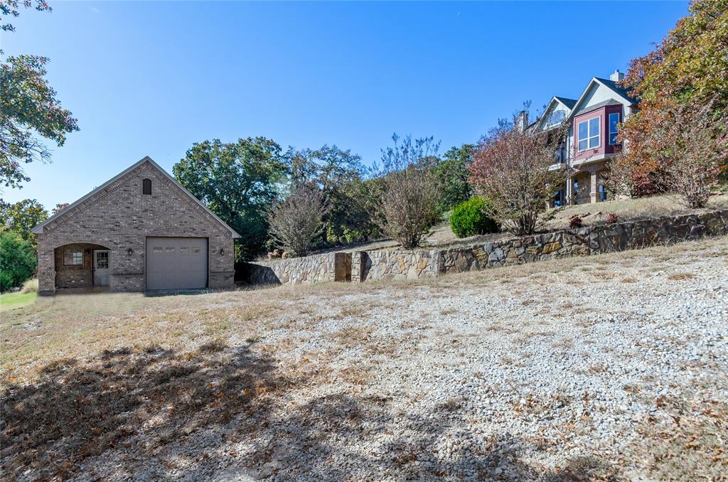 396 Ranchview Court Bowie, TX 76230 - Photo 27 of 40 a front view of a house with a yard