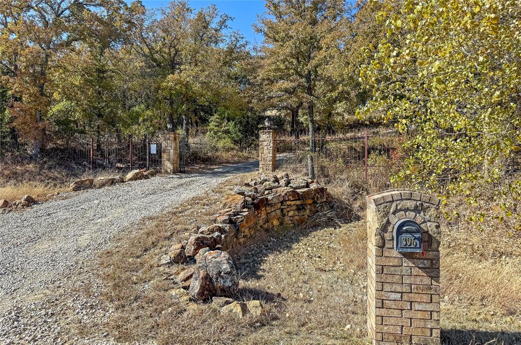 396 Ranchview Court Bowie, TX 76230 - Photo 29 of 40 a view of a yard with wooden fence