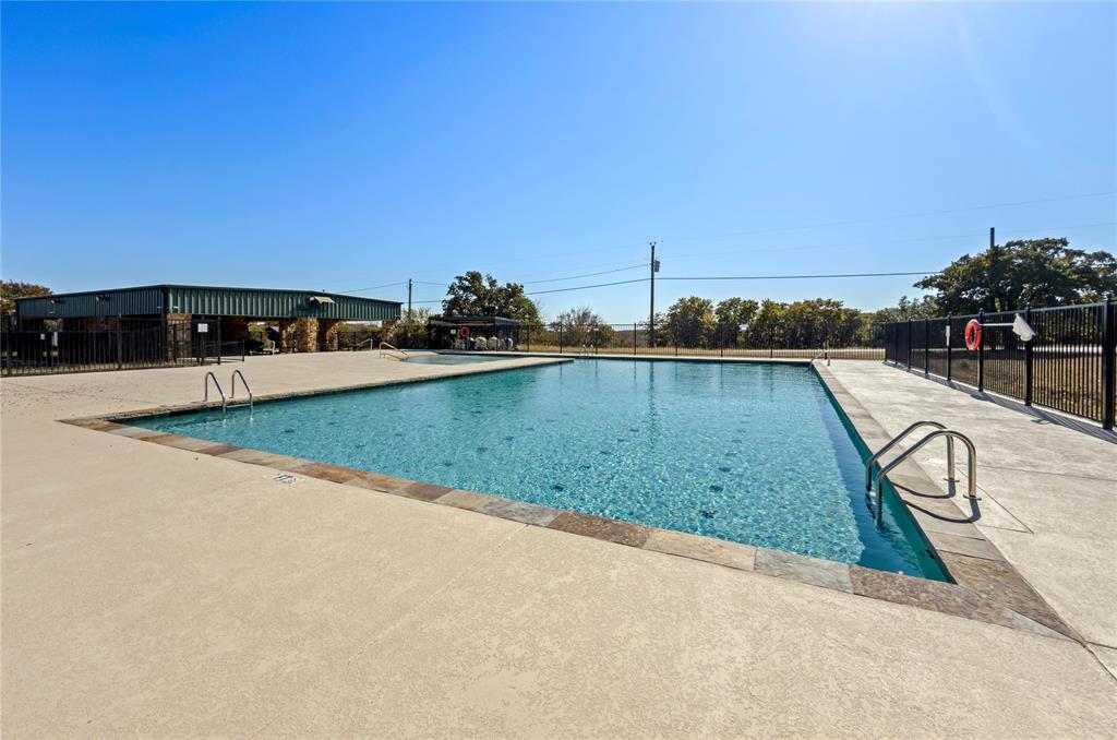 396 Ranchview Court Bowie, TX 76230 - Photo 33 of 40 a view of a swimming pool and a yard