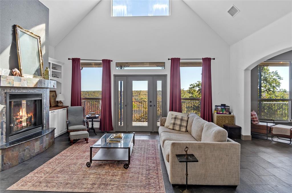 396 Ranchview Court Bowie, TX 76230 - Photo 4 of 40 a living room with furniture and a fireplace