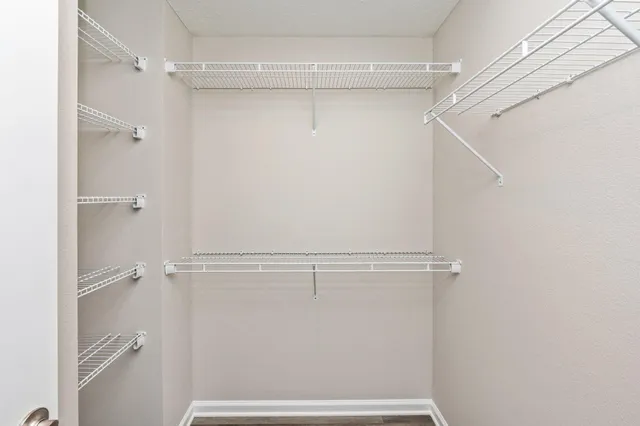 a view of an empty walk in closet