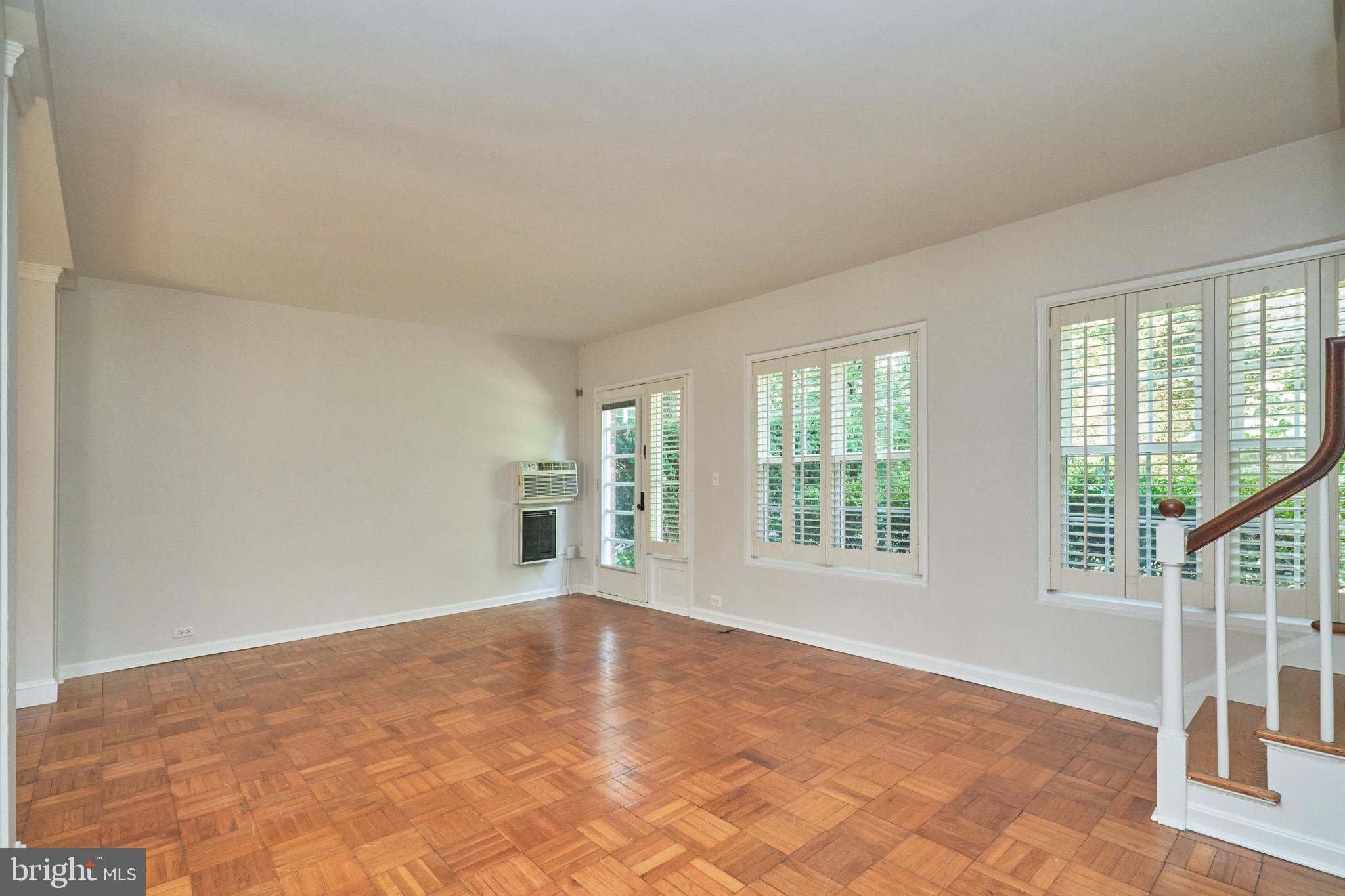 3314 Gunston Road, Unit 7303314 Alexandria, VA 22302 - Photo 18 of 42 Spacious living room with gleaming parquet