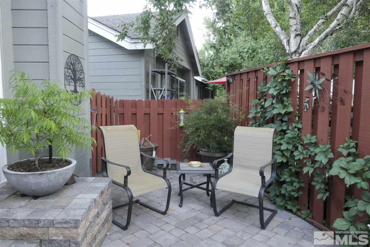 3288 Alum Creek Court Reno, NV 89509 - Photo 16 of 20 a view of a patio with couple of chairs and a potted plant