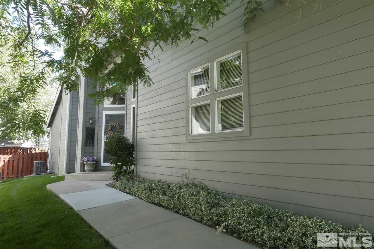 3288 Alum Creek Court Reno, NV 89509 - Photo 17 of 20 a front view of a house with garden