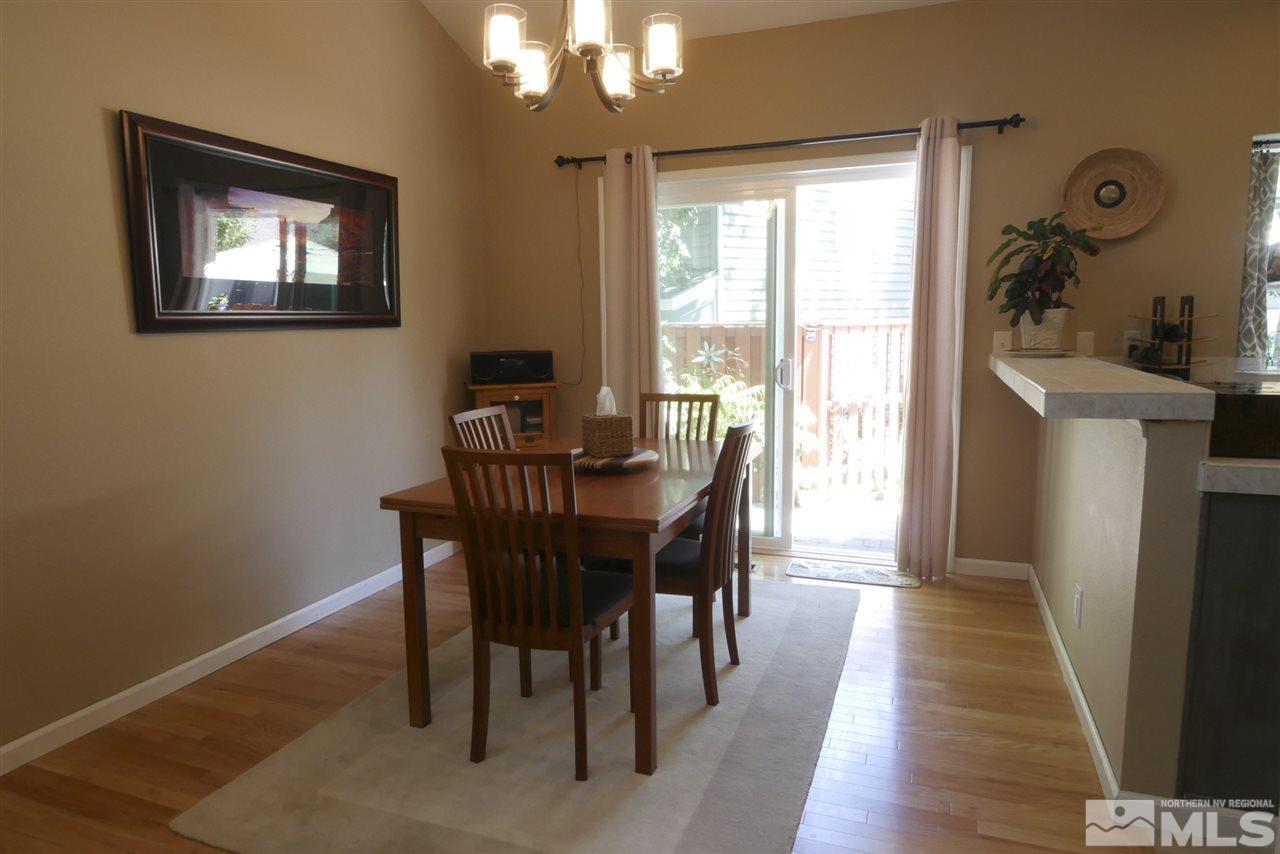 3288 Alum Creek Court Reno, NV 89509 - Photo 4 of 20 a view of a dining room with furniture window and wooden floor