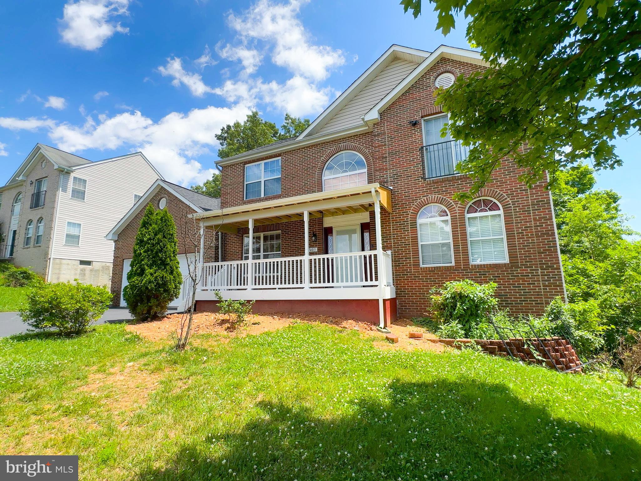 7403 Hawthorne Street Landover, MD 20785 - Photo 2 of 39 a front view of a house with a yard