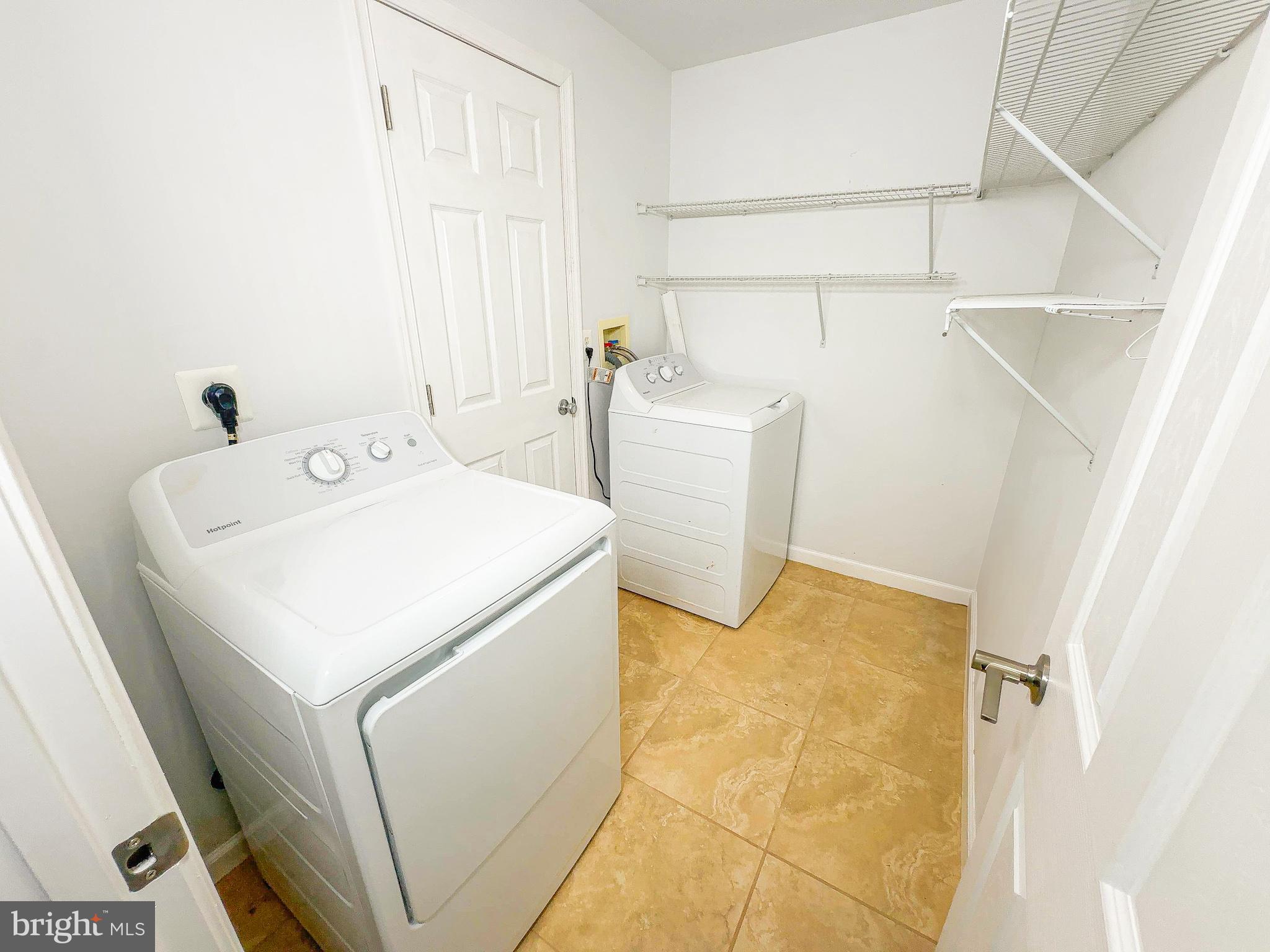 7403 Hawthorne Street Landover, MD 20785 - Photo 30 of 39 a utility room with dryer and washer