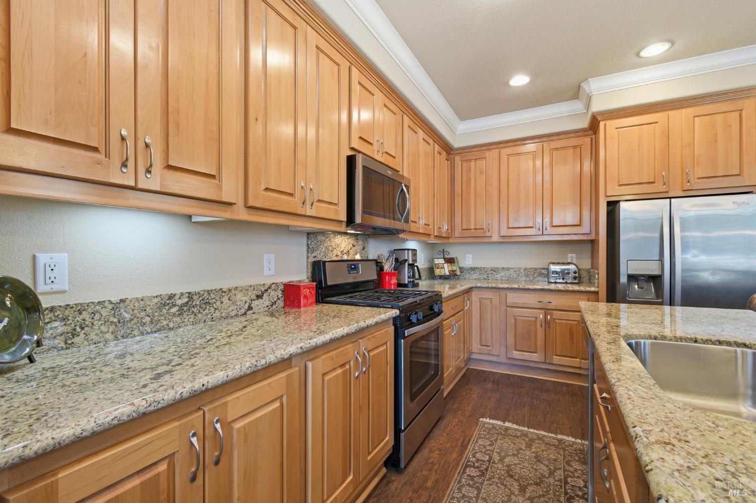120 Shamrock Circle Santa Rosa, CA 95403 - Photo 17 of 45 a kitchen with stainless steel appliances granite countertop a sink stove and cabinets