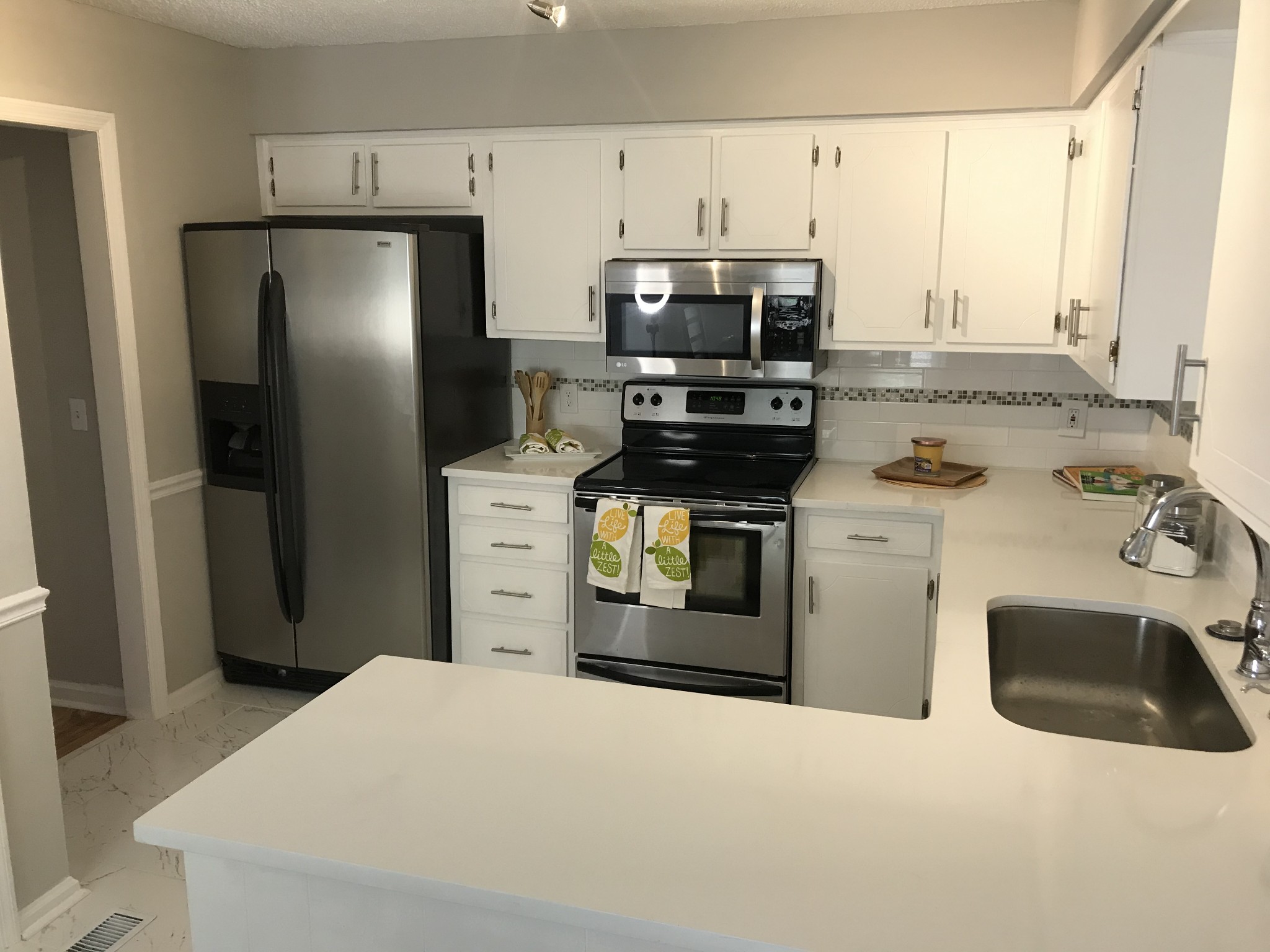 3361 Country Way Road Antioch, TN 37013 - Photo 8 of 23 a kitchen with stainless steel appliances a sink stove and refrigerator
