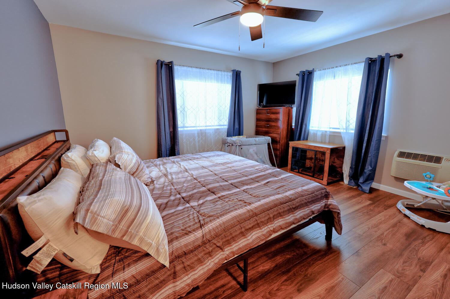 626 Bross Street Cairo, NY 12413 - Photo 32 of 78 a bedroom with a bed and a chandelier