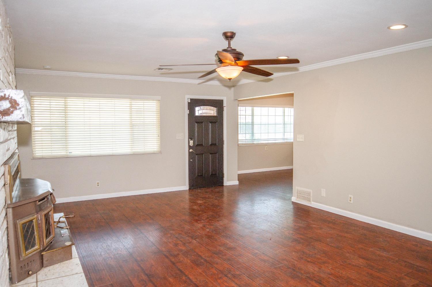 5357 South Hills Valley Road Orange Cove, CA 93646 - Photo 11 of 55 a view of a livingroom with a window and wooden floor