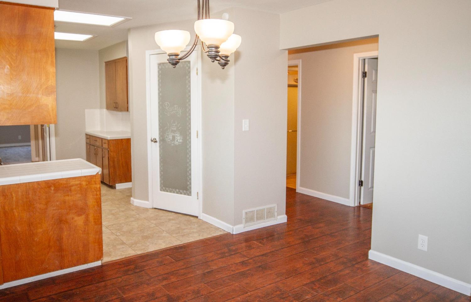5357 South Hills Valley Road Orange Cove, CA 93646 - Photo 15 of 55 a view of a kitchen with a refrigerator and a stove top oven
