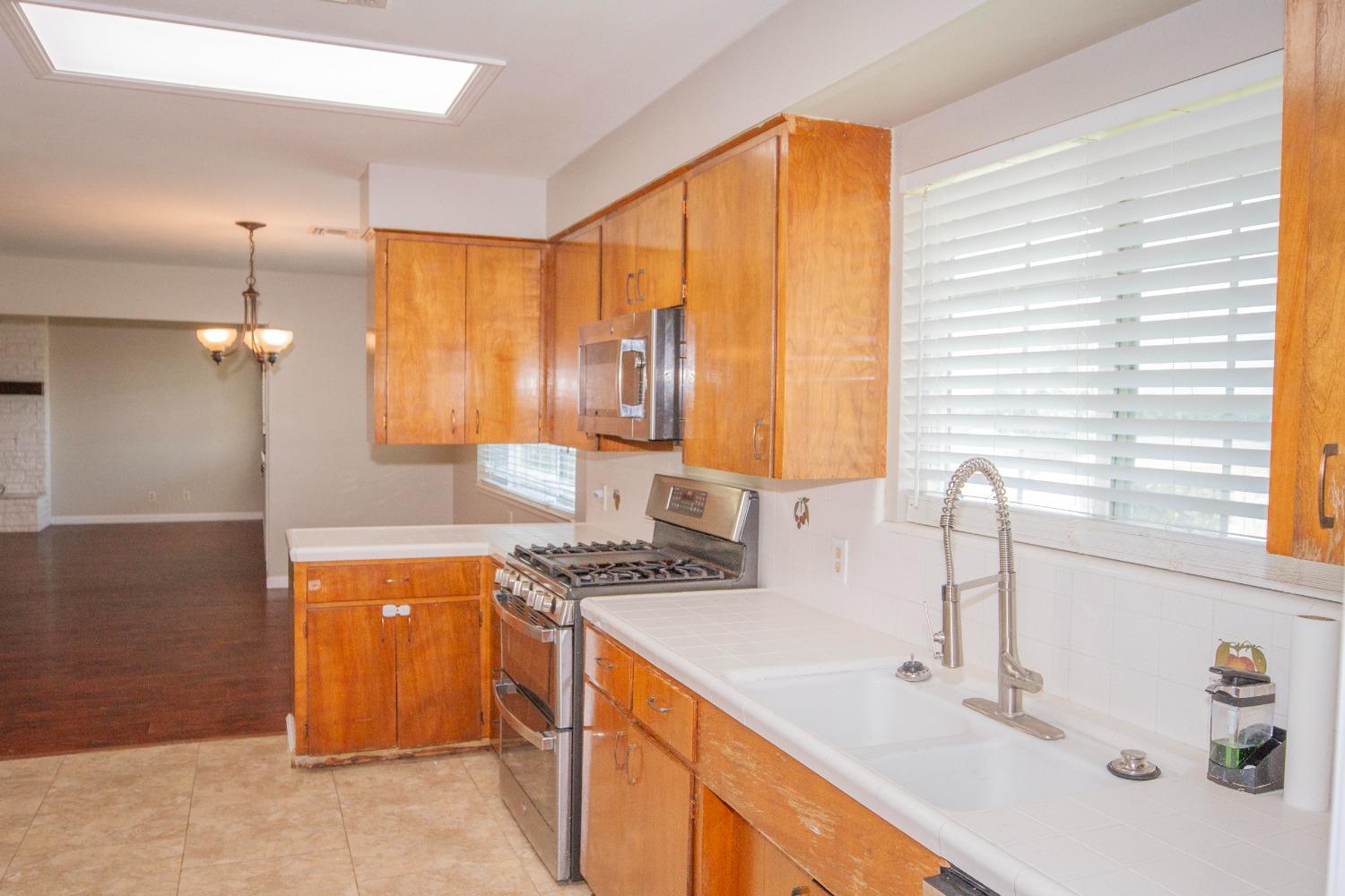 5357 South Hills Valley Road Orange Cove, CA 93646 - Photo 19 of 55 a bathroom with a sink and a mirror