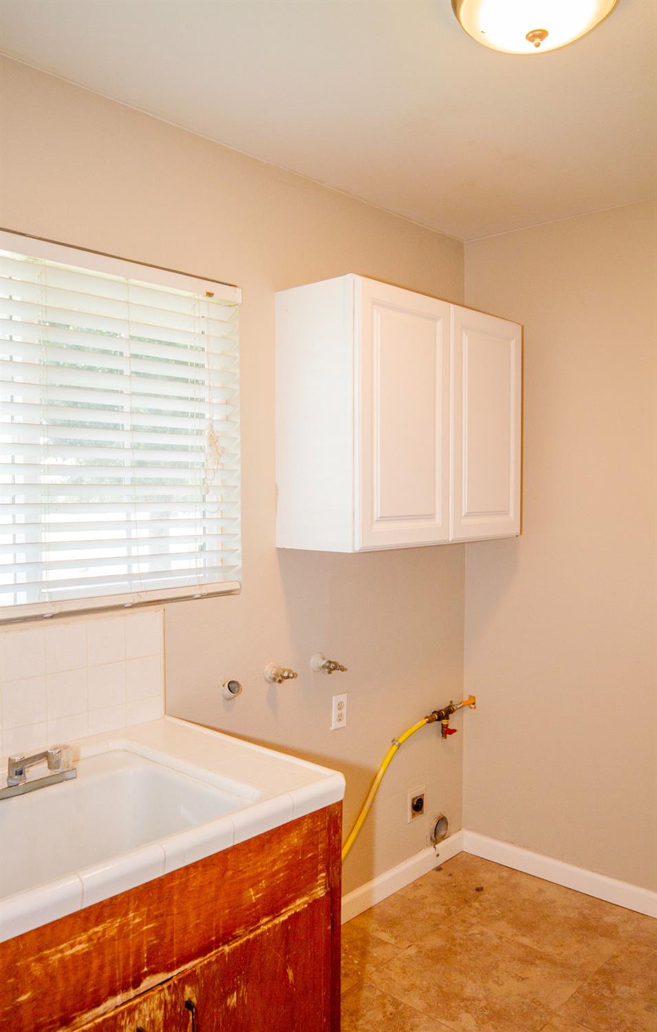 5357 South Hills Valley Road Orange Cove, CA 93646 - Photo 21 of 55 a room with a window and a ceiling fan