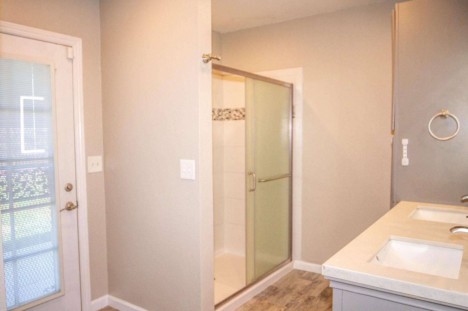 5357 South Hills Valley Road Orange Cove, CA 93646 - Photo 26 of 55 a bathroom with a tub and shower