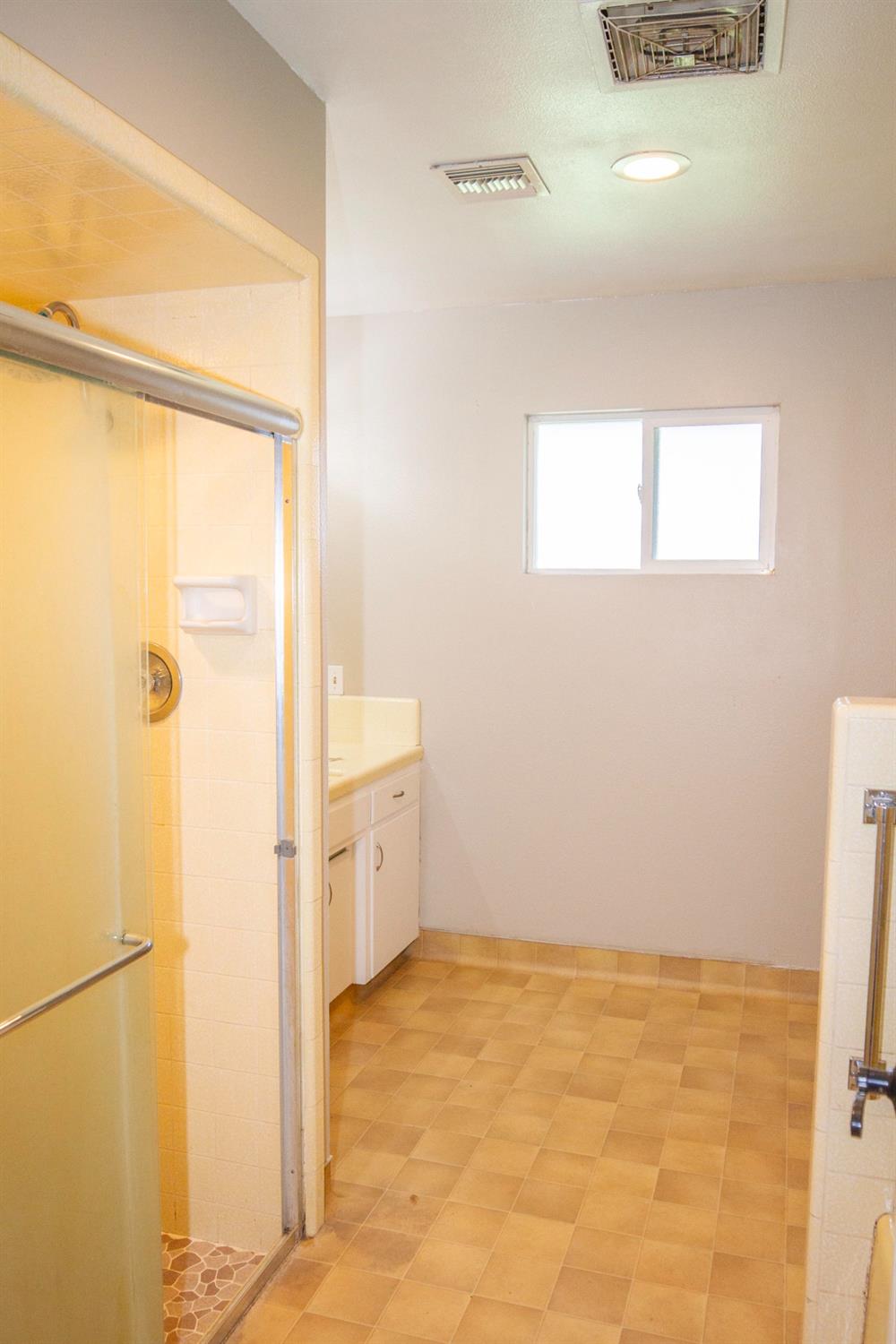 5357 South Hills Valley Road Orange Cove, CA 93646 - Photo 29 of 55 a view of a bathroom with a shower