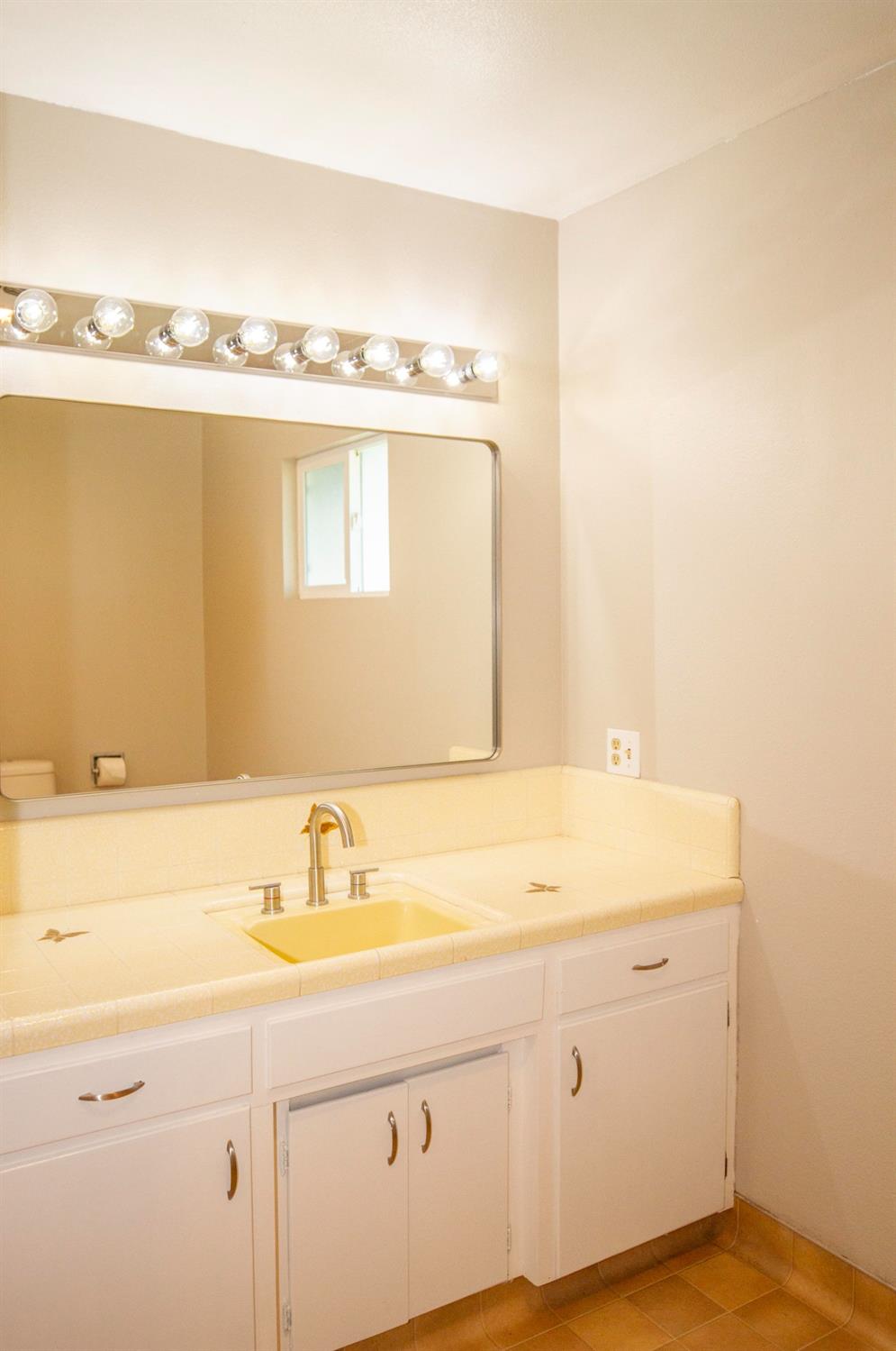 5357 South Hills Valley Road Orange Cove, CA 93646 - Photo 30 of 55 a bathroom with a sink and a mirror
