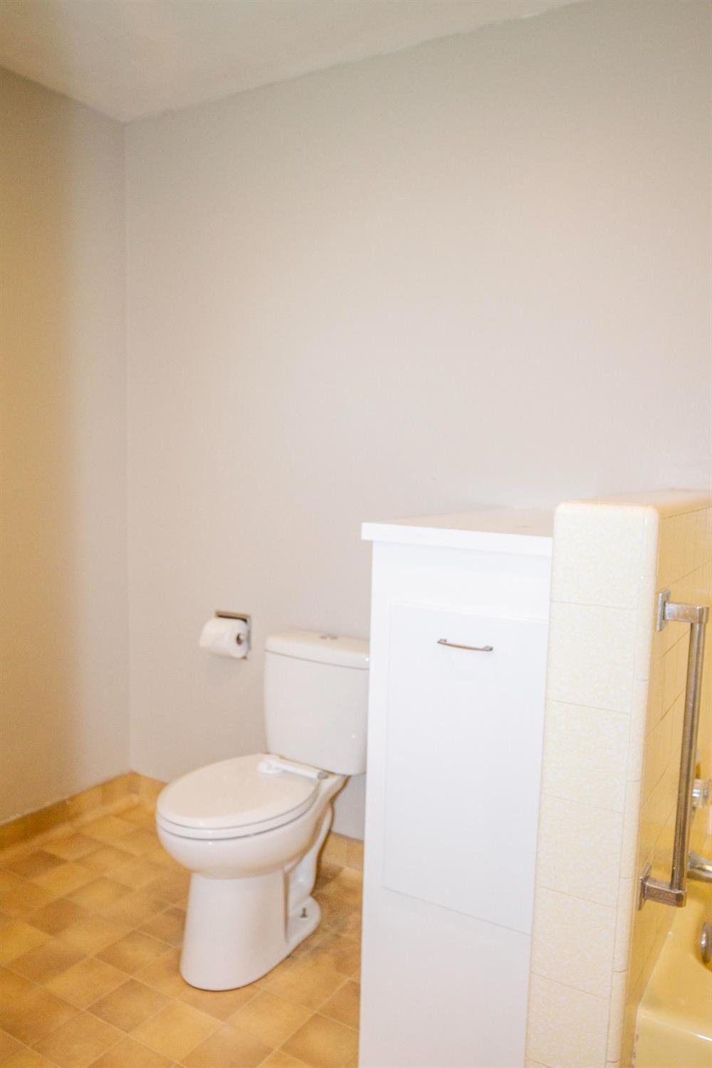 5357 South Hills Valley Road Orange Cove, CA 93646 - Photo 32 of 55 a white toilet sitting next to a white sink