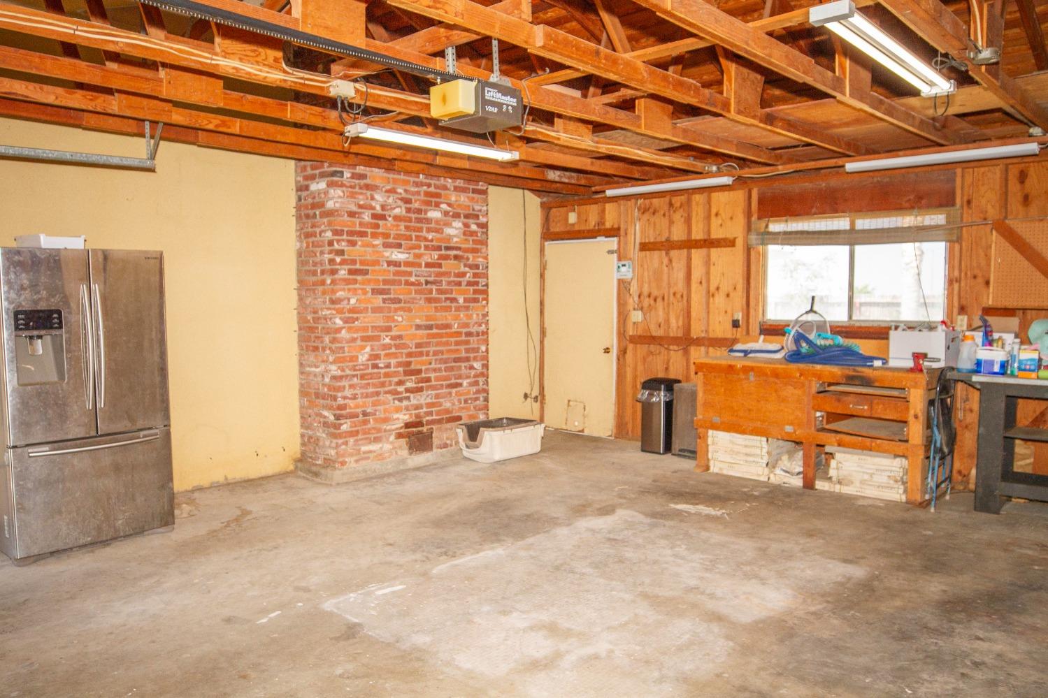 5357 South Hills Valley Road Orange Cove, CA 93646 - Photo 37 of 55 a view of a room with furniture and a kitchen