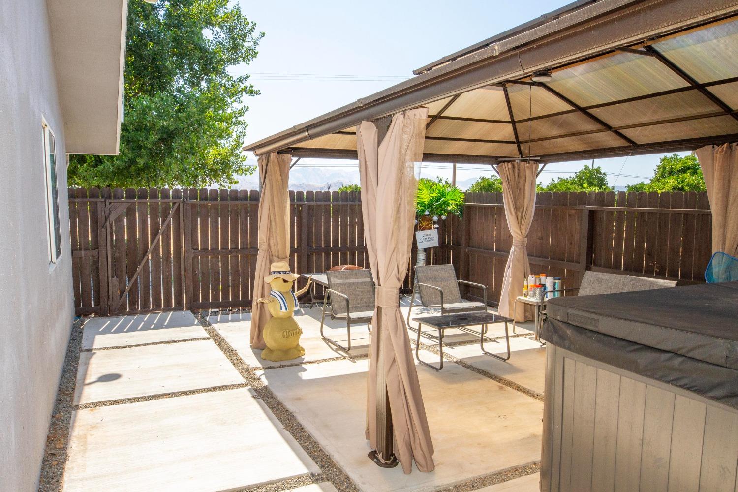 5357 South Hills Valley Road Orange Cove, CA 93646 - Photo 46 of 55 a view of a chair and tables in the patio