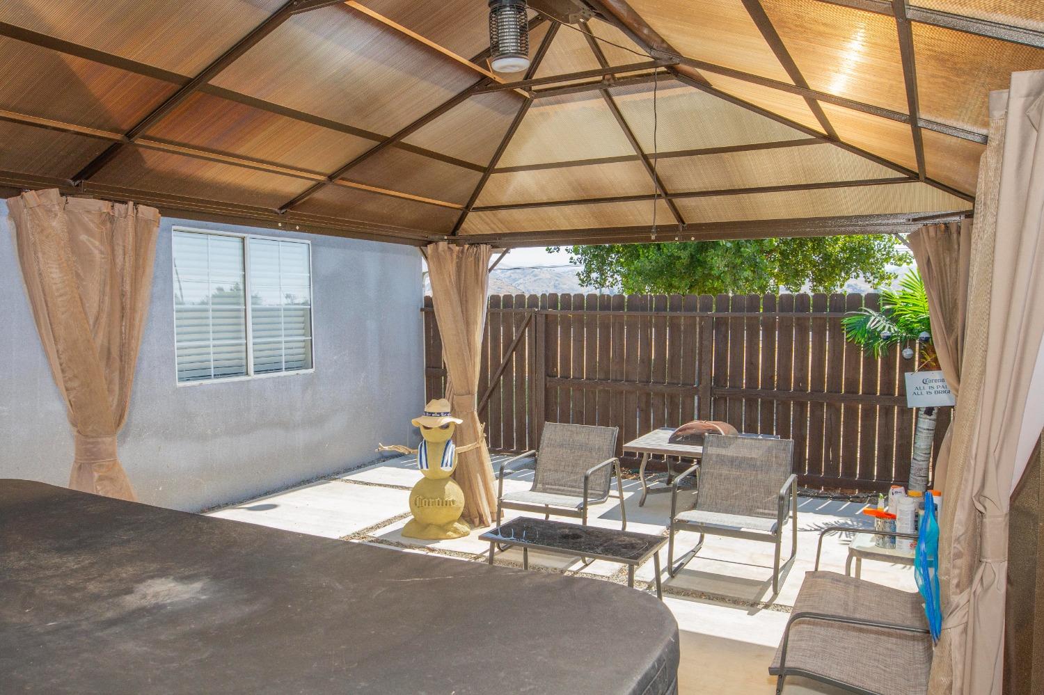5357 South Hills Valley Road Orange Cove, CA 93646 - Photo 47 of 55 a view of a chairs and table in patio