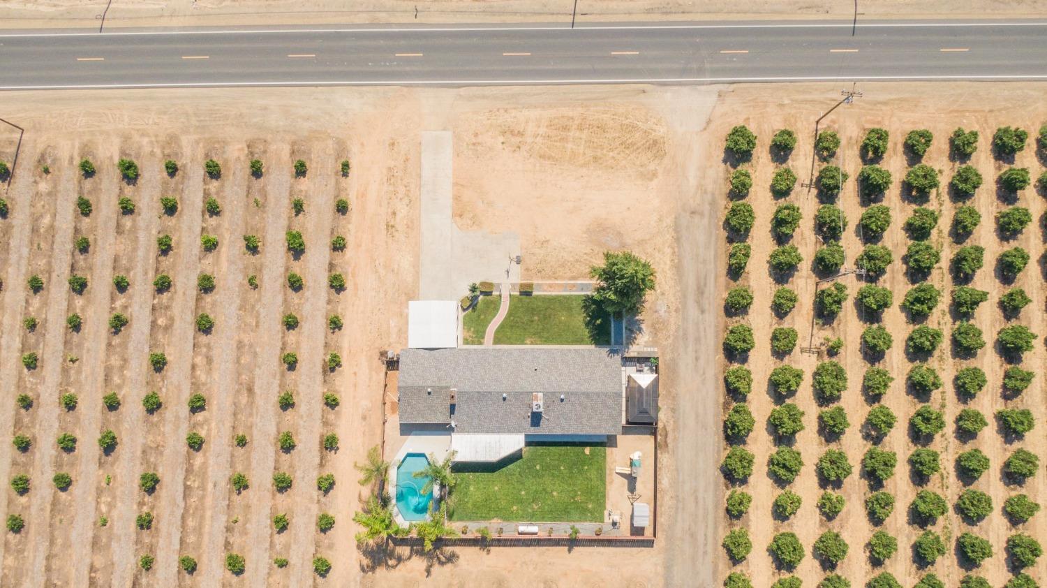 5357 South Hills Valley Road Orange Cove, CA 93646 - Photo 10 of 55 a bathroom with a bathtub and a shower curtain