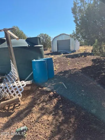 a view of backyard with outdoor space