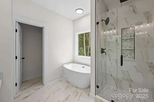 a bathroom with a toilet and shower