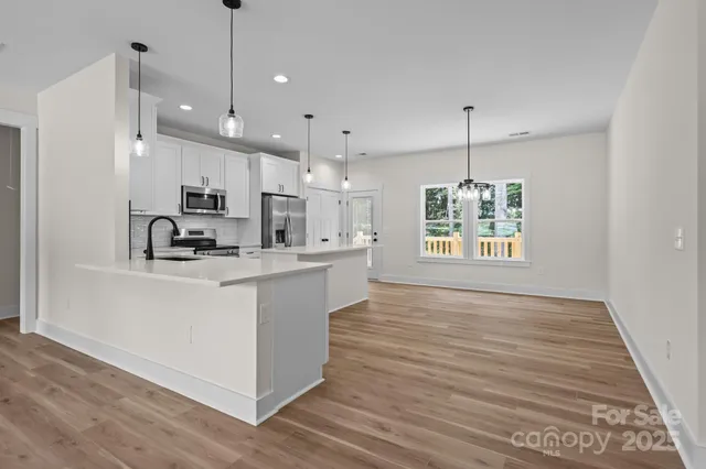 a view of kitchen and kitchen with electric equipment