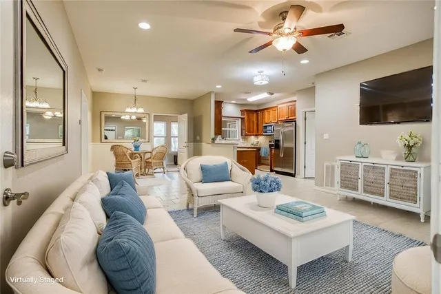 a large kitchen with stainless steel appliances granite countertop a refrigerator and a stove top oven