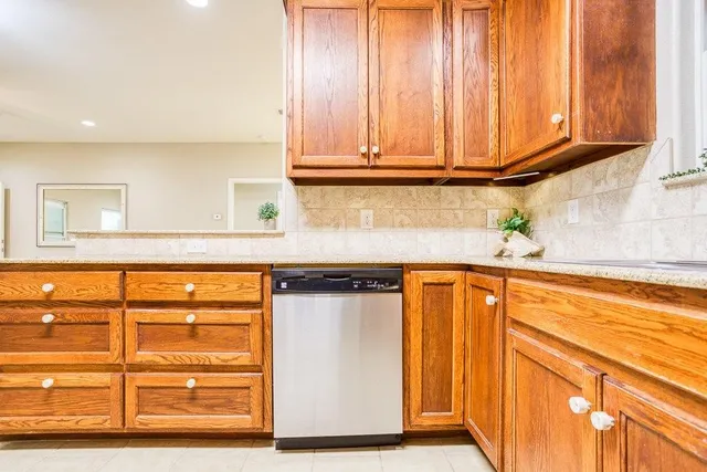 a kitchen with granite countertop a sink and a window