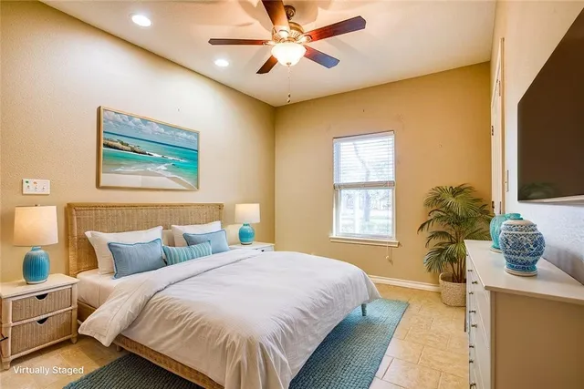 an empty room with closet and windows