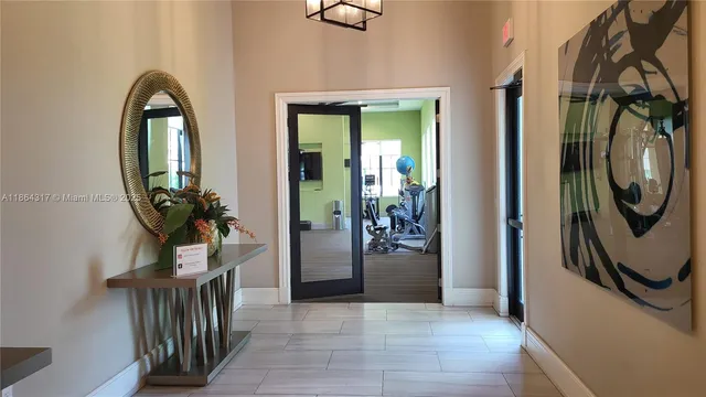 a view of a entryway door with wooden floor