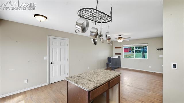 9715 Bar B Road Fountain, CO 80817 - Photo 12 of 34 The Kitchen/Dining Area has convenient garage access.