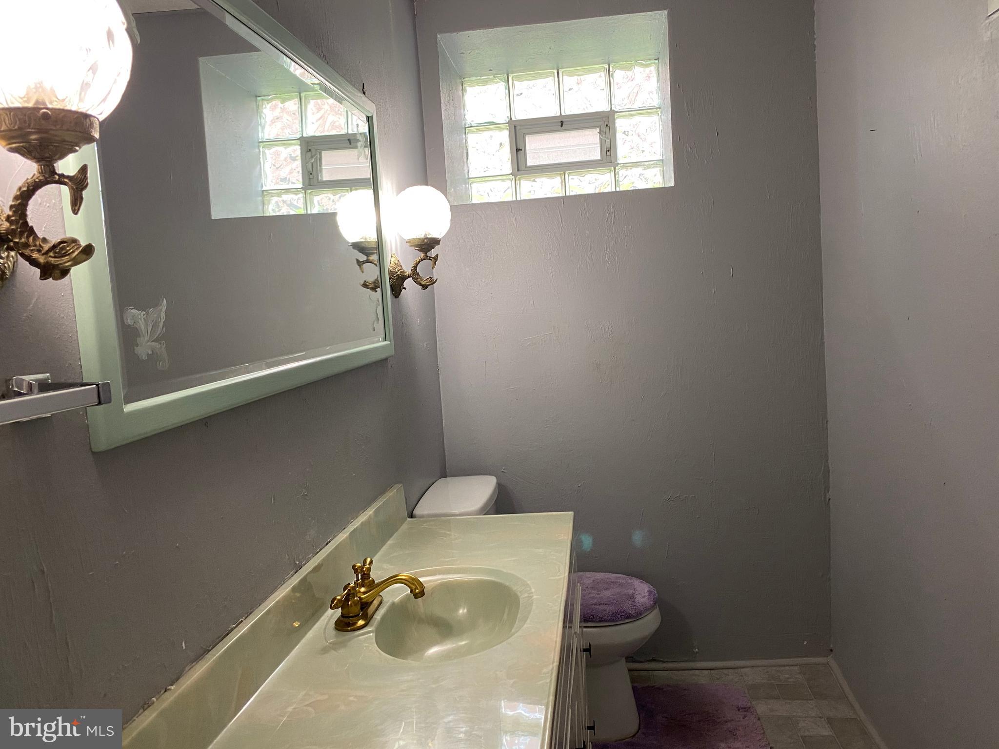 1615 Fox Chase Road Philadelphia, PA 19152 - Photo 22 of 30 Half Bath -with Decorative sconces and window