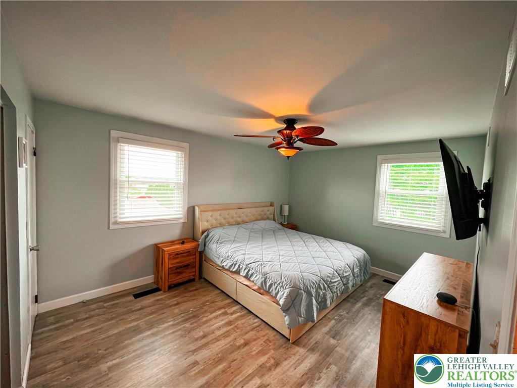 10 Dusty Road Easton, PA 18045 - Photo 26 of 35 Relax in this tranquil sleeping area, bathed in natural light, offering a comforting retreat.