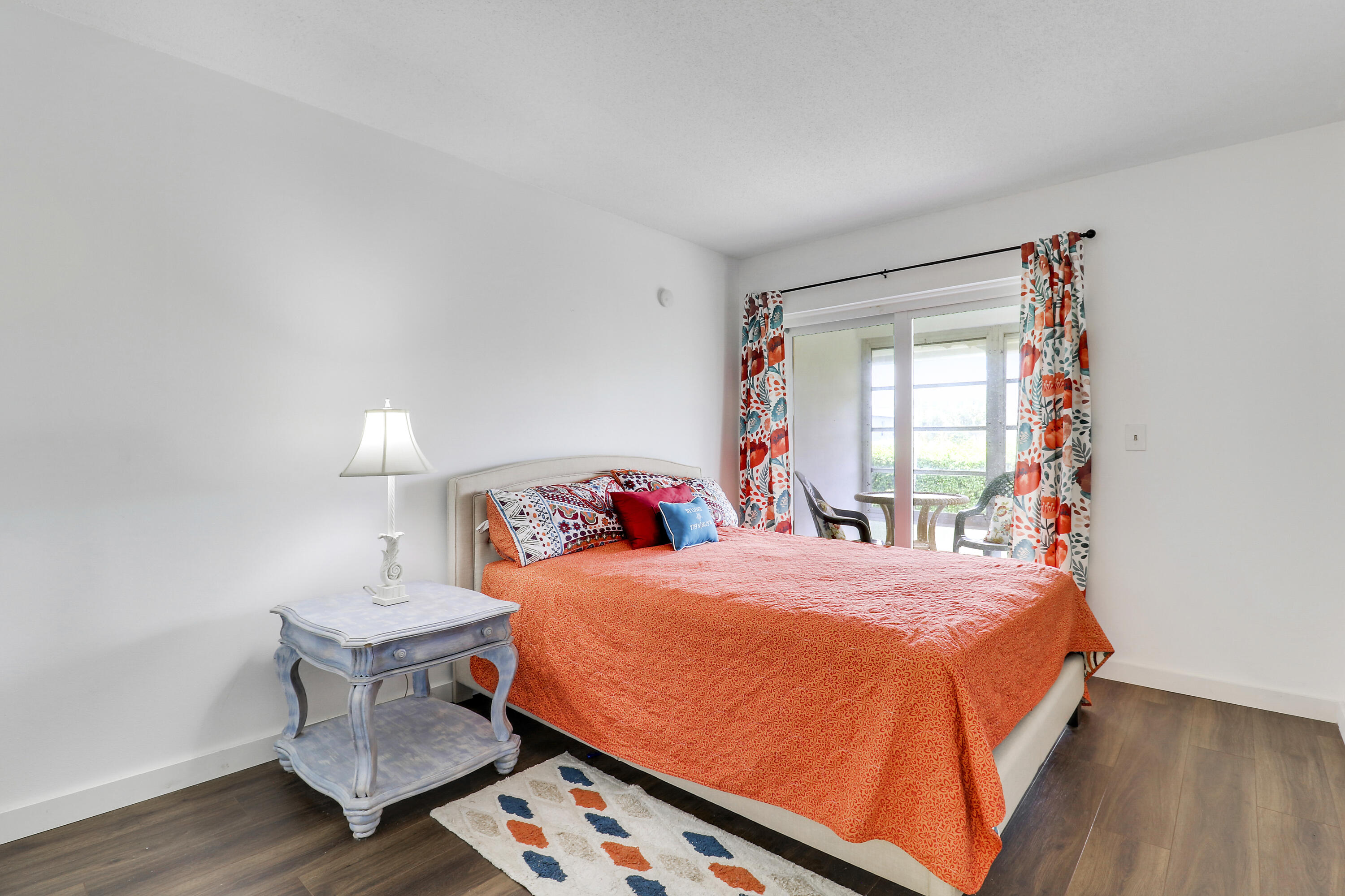 2929 Southeast Ocean Boulevard, Unit I9 Stuart, FL 34996 - Photo 16 of 19 a bedroom with a bed and a window