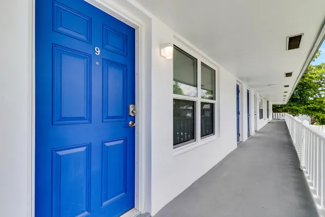 a view of a hallway with wooden walls and stairs