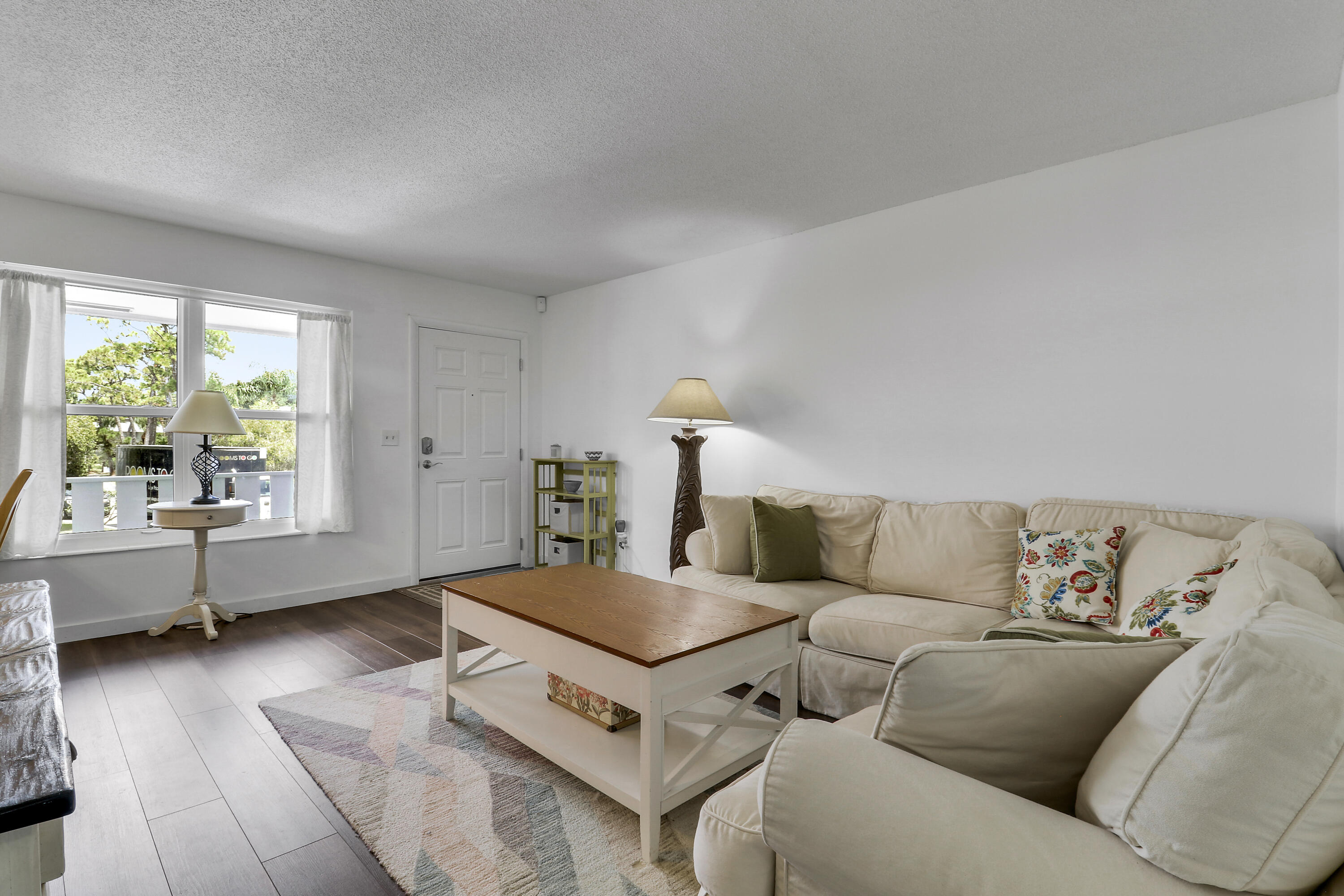 2929 Southeast Ocean Boulevard, Unit I9 Stuart, FL 34996 - Photo 5 of 19 a living room with furniture and window