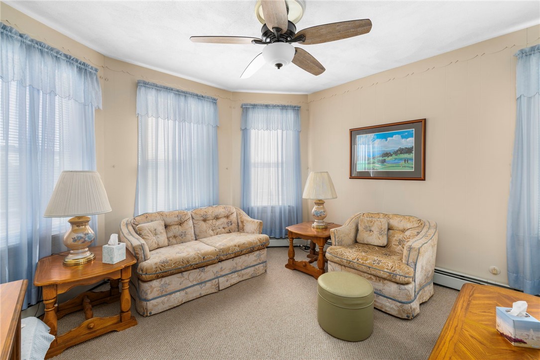 20 Gridley Street Providence, RI 02904 - Photo 14 of 50 Unit 1 - Living Room - carpet, 3 picture windows, high ceilings