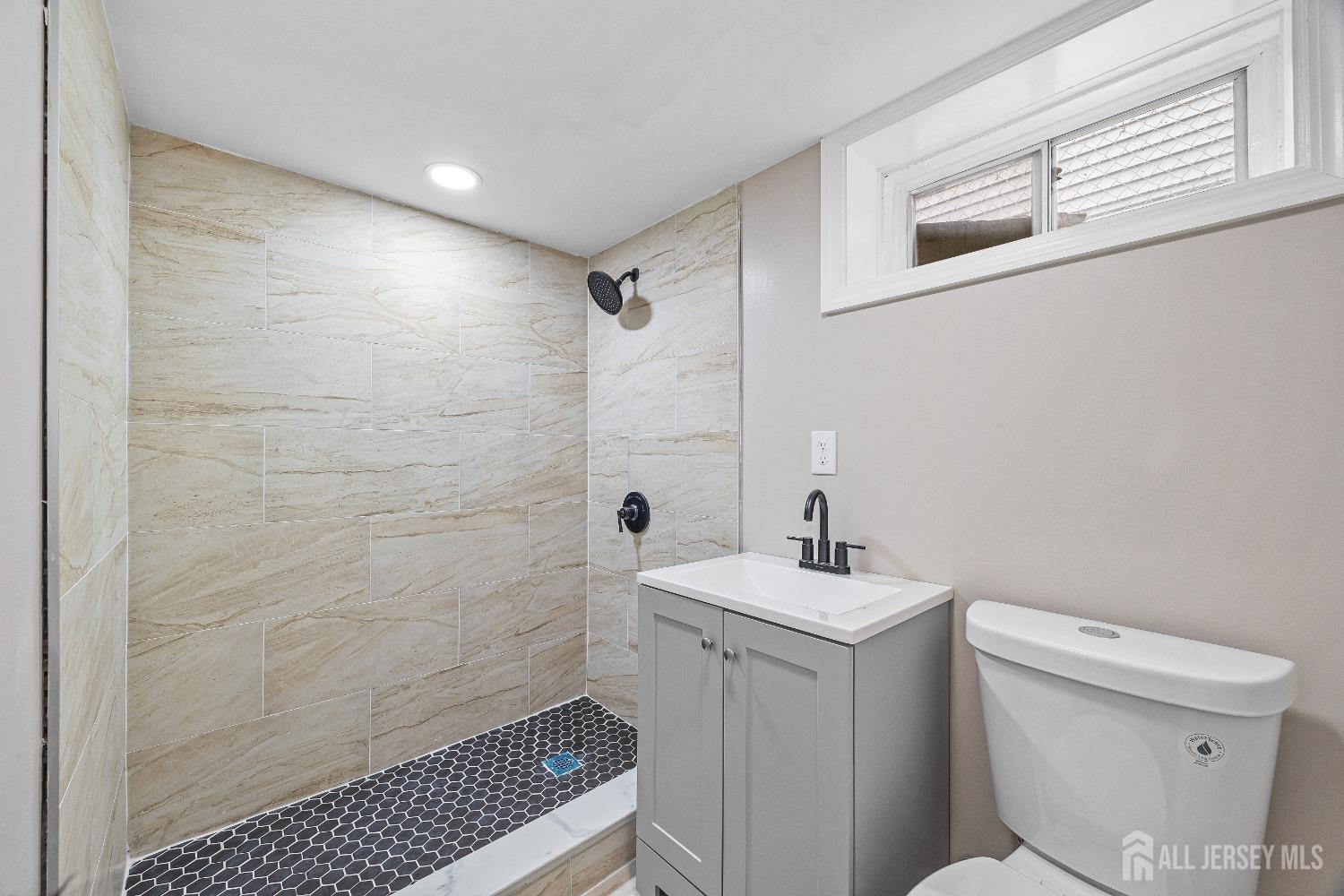 92 Highfield Road Colonia, NJ 07067 - Photo 18 of 25 a bathroom with a sink toilet and shower