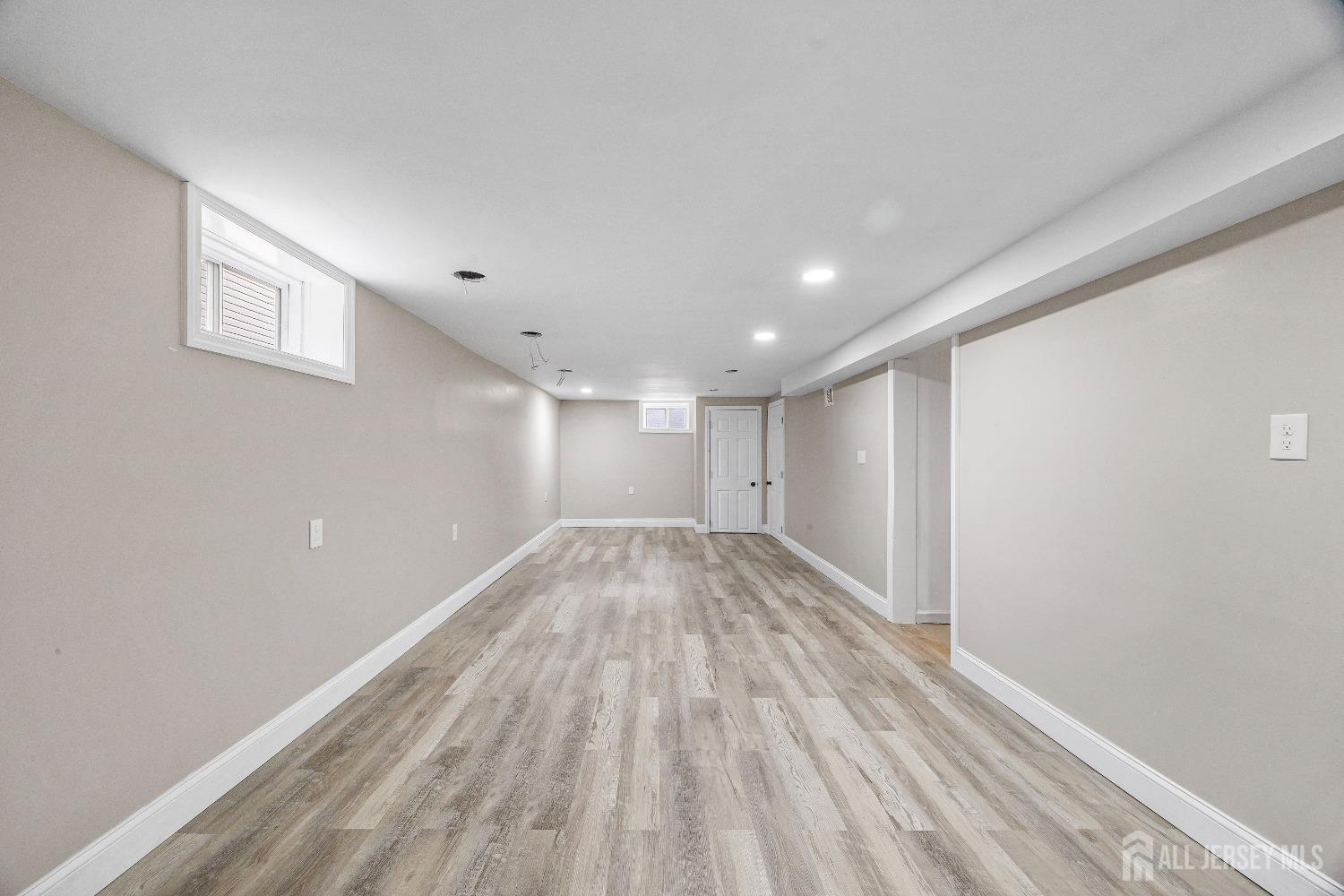 92 Highfield Road Colonia, NJ 07067 - Photo 20 of 25 a view of empty room with wooden floor